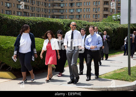 President Barack Obama walks to lunch at Chipotle restaurant with, from left, Shirley Young, Lisa Rumain, Shelby Ramirez and Roger Trombley before he attends the White House Summit on Working Families in Washington, D.C., June 23, 2014. Stock Photo