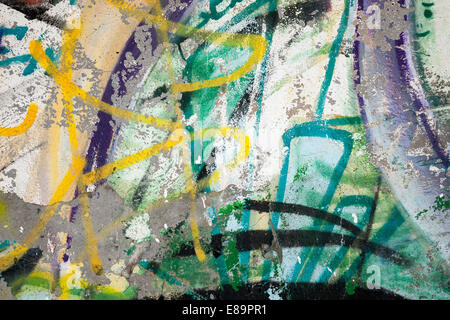 Abstract colorful paint graffiti fragment on gray urban concrete wall Stock Photo