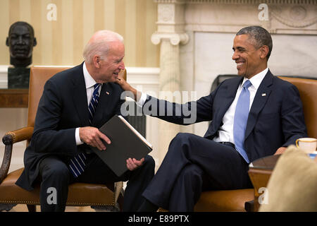 President Barack Obama and Vice President Joe Biden share a laugh in the Oval Office  July 21, 2014. Stock Photo