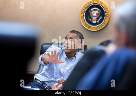 President Barack Obama meets with his national security advisors concerning the situation in Iraq, in the Situation Room of the Stock Photo