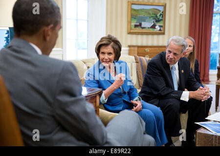 President Barack Obama meets with House Minority Leader Nancy Pelosi, D-Calif. and Democratic Congressional Campaign Committee Chairman Rep. Steve Israel, D-N.Y. in the Oval Office, July 31, 2014. Kelly Ward, Executive Director of the DCCC, seated at righ Stock Photo