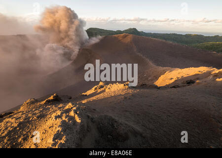 People on the crater rim of Mount Yasur volcano, Tanna Island, Vanuatu Stock Photo