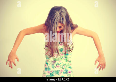 portrait of a young brunette woman performing contemporary dance, with a retro effect Stock Photo