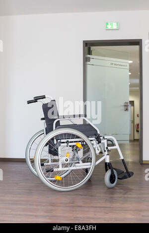 Empty wheelchair in hospital Stock Photo