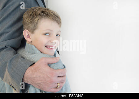 Father holding son, smiling Stock Photo