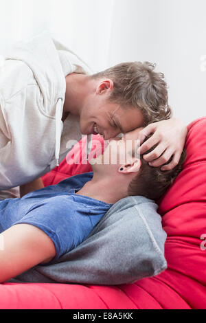 Homosexual couple caress each other, smiling Stock Photo