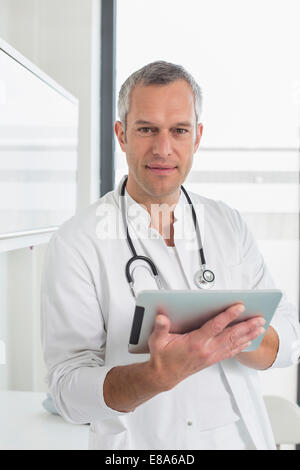 Doctor holding digital tablet, portrait Stock Photo