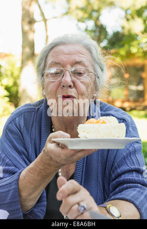 Portrait of grandmother summer garden cake