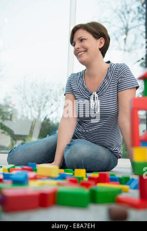 Mother with building bricks Stock Photo