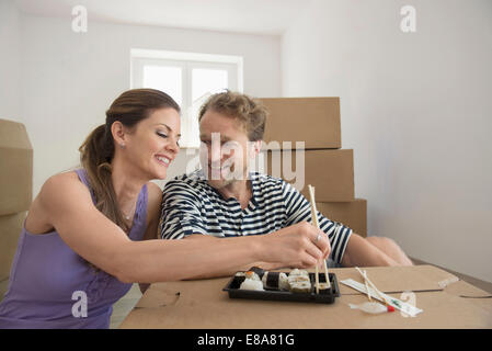 Couple lunch resting eating new apartment Stock Photo