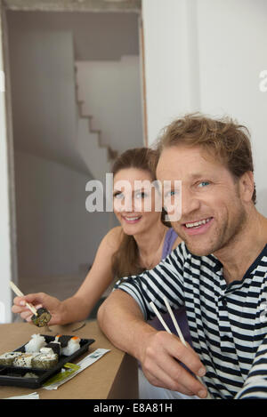Portrait couple lunch resting eating sushi Stock Photo