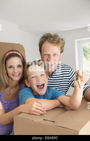 Young family happy new home house keys Stock Photo