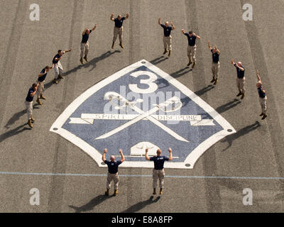 U.S. Marine Corps drill instructors with the 3rd Recruit Training Battalion complete a combined 3,000 burpees in 12 hours as part of a 9/11 memorial at Parris Island, S.C., Sept. 11, 2014. Terrorists hijacked four passenger aircraft Sept. 11, 2001. Two of Stock Photo