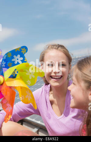 Portrait two girls holding toy windmill Stock Photo