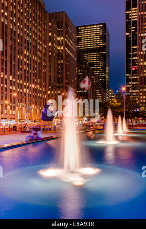 Illuminated fountains on the Avenue of the Americas in Midtown Manhattan, New York City - USA. Stock Photo