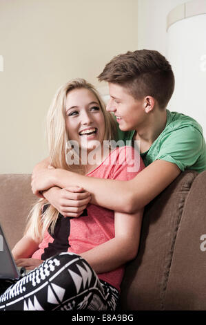 Teenage couple having fun at home Stock Photo