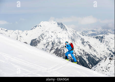 Man climbing mountain Alps snow winter Stock Photo