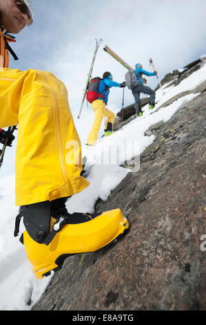 Rock climbing cross-country skiers snow Stock Photo