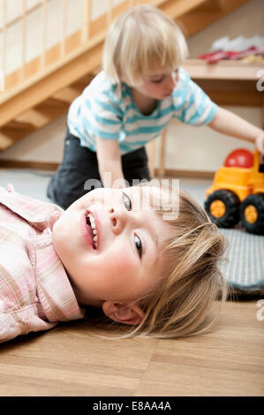 Little girl and little boy playing in kindergarten