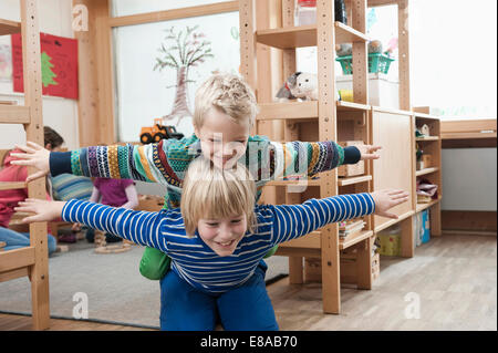 Two brothers playing together Stock Photo
