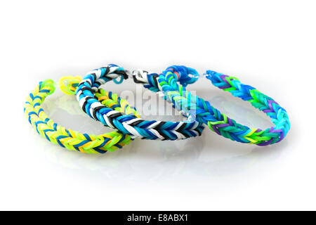 Three style colorful rubber bracelets isolated on a white background. Stock Photo