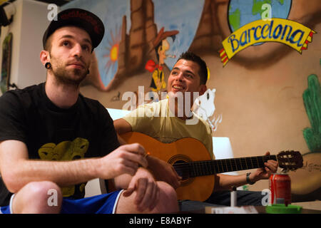 Two young men smoking marihuana Inside ADICB Cannabis association.  BARCELONA COFFEE SHOPS CANNABIS Marijuana In Barcelona  If y Stock Photo