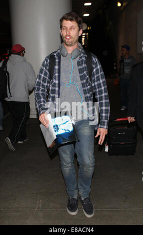 Napoleon Dynamite actor Jon Heder pools a goofy face as he arrives at Los Angeles International Airport (LAX)  Featuring: Jon Heder Where: Los Angeles, California, United States When: 30 Mar 2014 Stock Photo