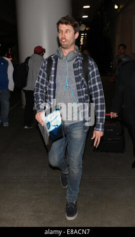 Napoleon Dynamite actor Jon Heder pools a goofy face as he arrives at Los Angeles International Airport (LAX)  Featuring: Jon Heder Where: Los Angeles, California, United States When: 30 Mar 2014 Stock Photo