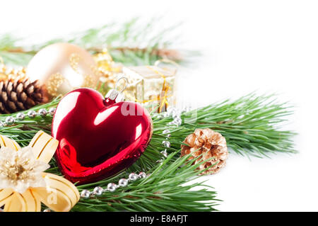 Christmas background with red heart, decorations and pine branch Stock Photo
