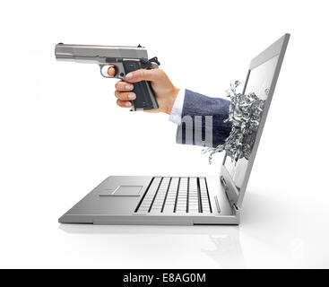 Man's hands, coming out from a computer laptop screen, forming a splash from liquid crystals, holding a silver gun. Viewed from Stock Photo