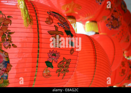Rows of traditional Chinese new year red lanterns with auspicious greetings