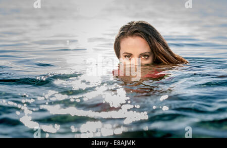 Portrait of young woman in swimming in sea, Castiadas, Sardinia, Italy Stock Photo