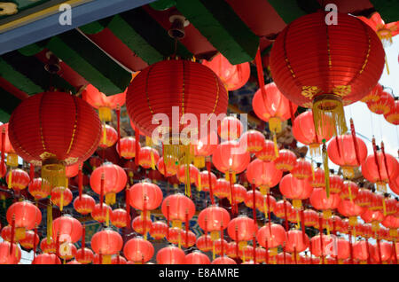 Red lanterns hanging in rows in temple to celebrate Chinese new year Stock Photo