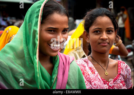 Rural Life in Rajasthan, Young girls in traditional colored clothes, sari Stock Photo