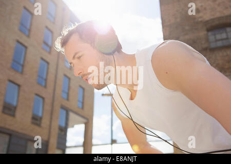Man taking break at exercise Stock Photo