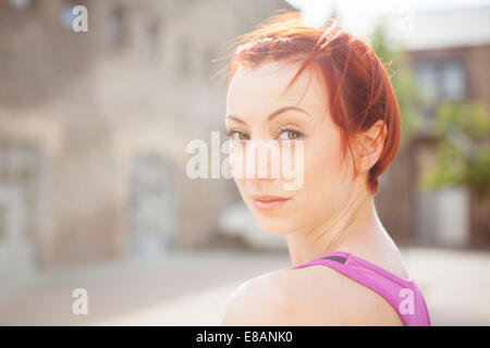 Red-haired woman in exercise top Stock Photo