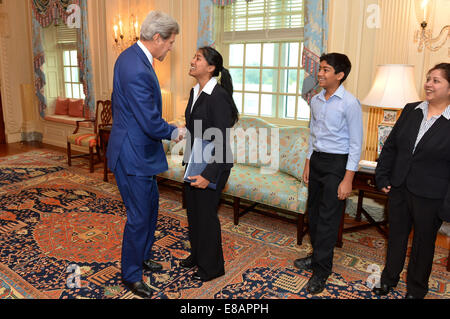 U.S. Secretary of State John Kerry congratulates American Foreign Service Association (AFSA) High School Essay contest winner Nitisha Baronia of San Ramon, California, at the U.S. Department of State in Washington, D.C., on September 29, 2014. Stock Photo