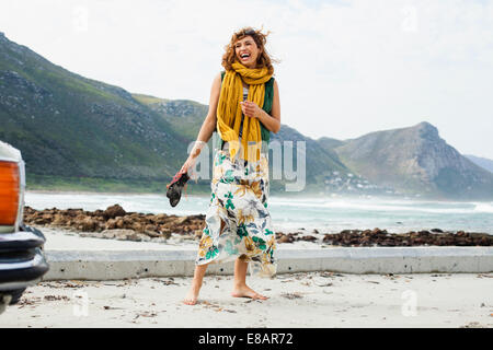 Young woman laughing on beach, Cape Town, Western Cape, South Africa Stock Photo