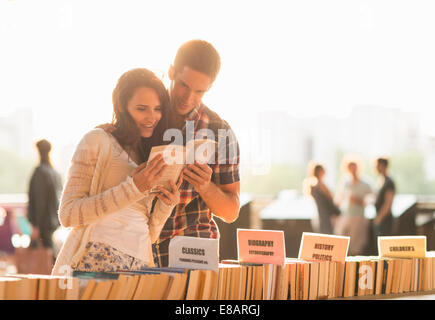Young couple at second hand book stall Stock Photo