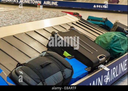 Baggage claim carousel with luggage at Hartsfield-Jackson Atlanta International Airport in Atlanta, Georgia, USA. Stock Photo