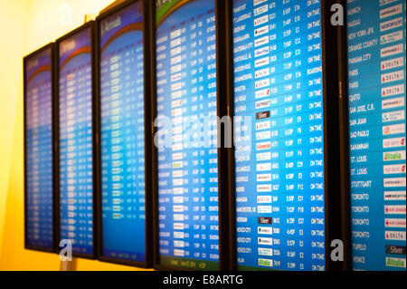Flight schedule information screens in the International Terminal at Atlanta International Airport, the world's busiest airport. Stock Photo