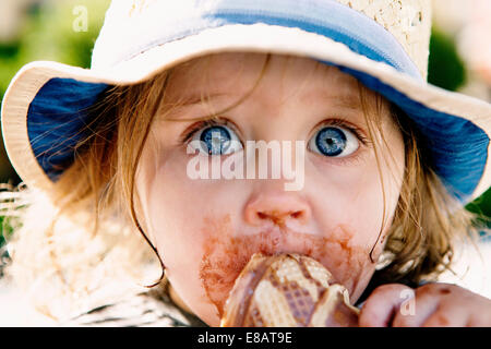 Young girl eating ice cream cone Stock Photo