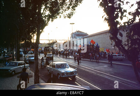 People demonstrating in the street stop traffic and trams during Portuguese Revolution Lisbon Portugal  1974 KATHY DEWITT Stock Photo