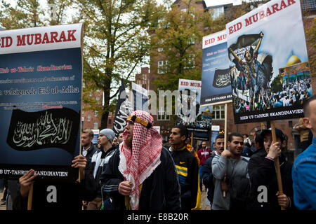Copenhagen, Denmark. 3rd October, 2014. Muslims gather in Copenhagen to celebrate the Eid feast organized by Hizb ut-Tharir.  This Eid event, - called Eid ul-Adha - is the second this year and is held 70 days after the end of Ramadan and coincides with the pilgrimage to Mecca. Hizb ut-Tharir see establishment of the caliphate, ruled by Islamic law, as its goal. Credit:  OJPHOTOS/Alamy Live News Stock Photo