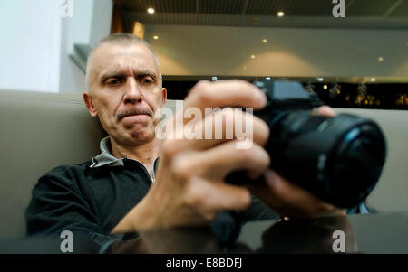 Male photographer with a camera Stock Photo