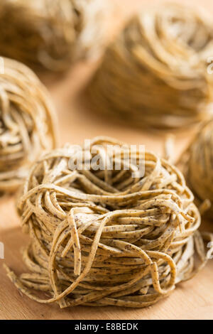 Tajarin or Tagliolini, made with fresh eggs and buckwheat flour, a specialty pasta shape from Piemonte, region of Italy Stock Photo