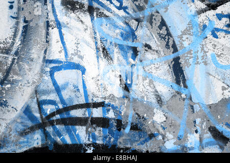 Abstract blue graffiti fragment on gray urban concrete wall Stock Photo