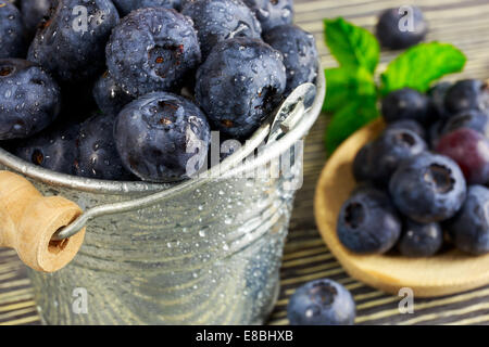 Fresh blueberries in a small metal bucket Stock Photo