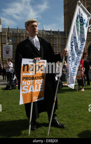 Lawyers and Probation Officers demonstrate outside Parliament against the Ministry of Justice's new 'Fee and Contract' arrangements. Meaning, people accused of a crime who can't afford a lawyer will not get justice.  Featuring: Barrister protesting Where: London, United Kingdom When: 01 Apr 2014 Stock Photo