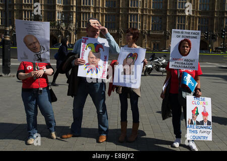 Lawyers and Probation Officers demonstrate outside Parliament against the Ministry of Justice's new 'Fee and Contract' arrangements. Meaning, people accused of a crime who can't afford a lawyer will not get justice.  Featuring: Atmosphere Where: London, United Kingdom When: 01 Apr 2014 Stock Photo